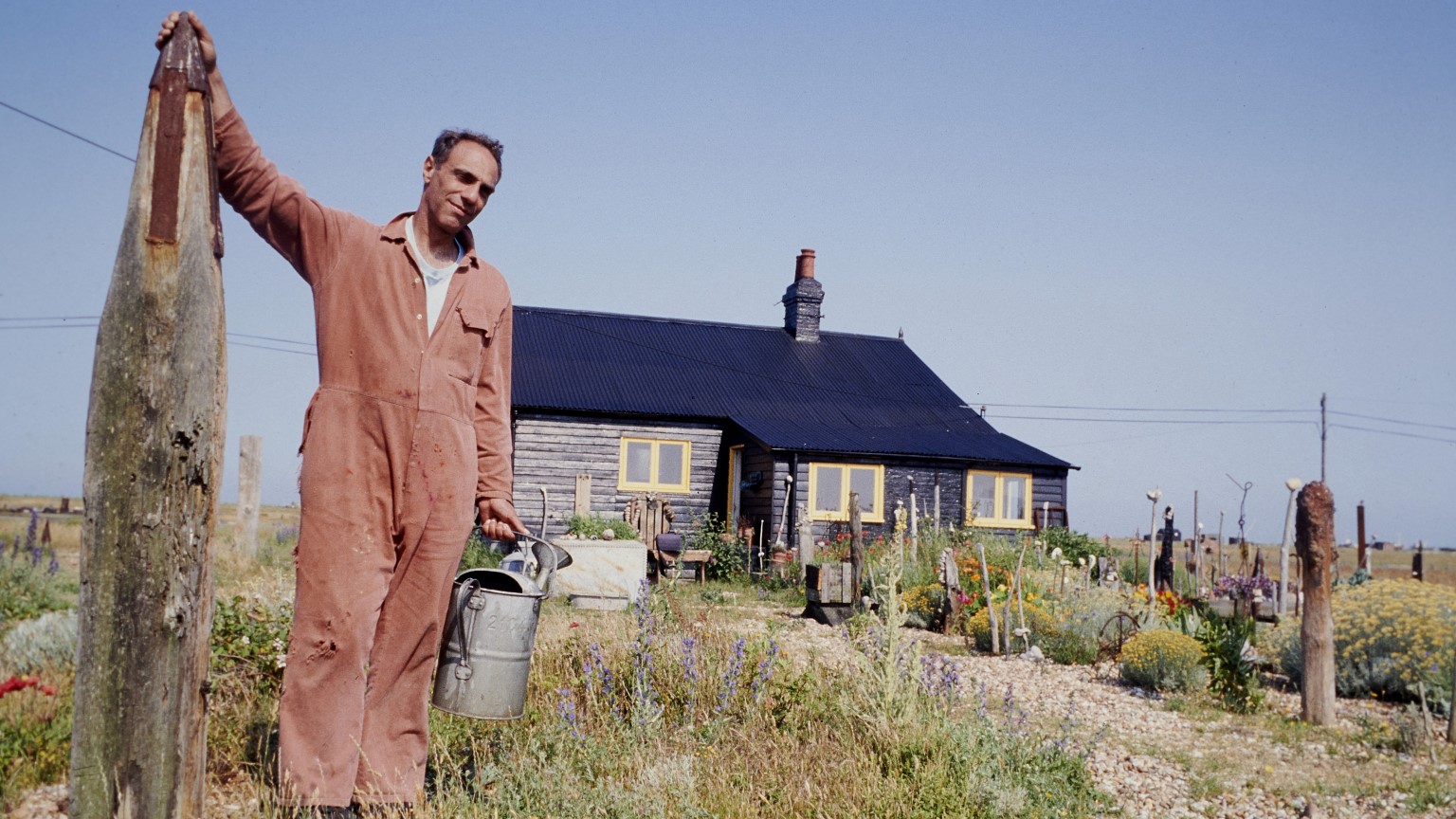 Derek Jarman outside Prospect Cottage