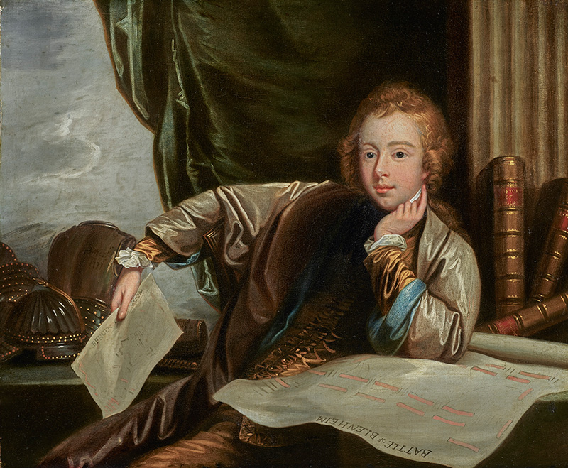 Portrait of General James Wolfe (1727-1759) when a boy, three-quarter length, seated at a desk in a grey cloak, a map of the Battle of Blenheim by his side